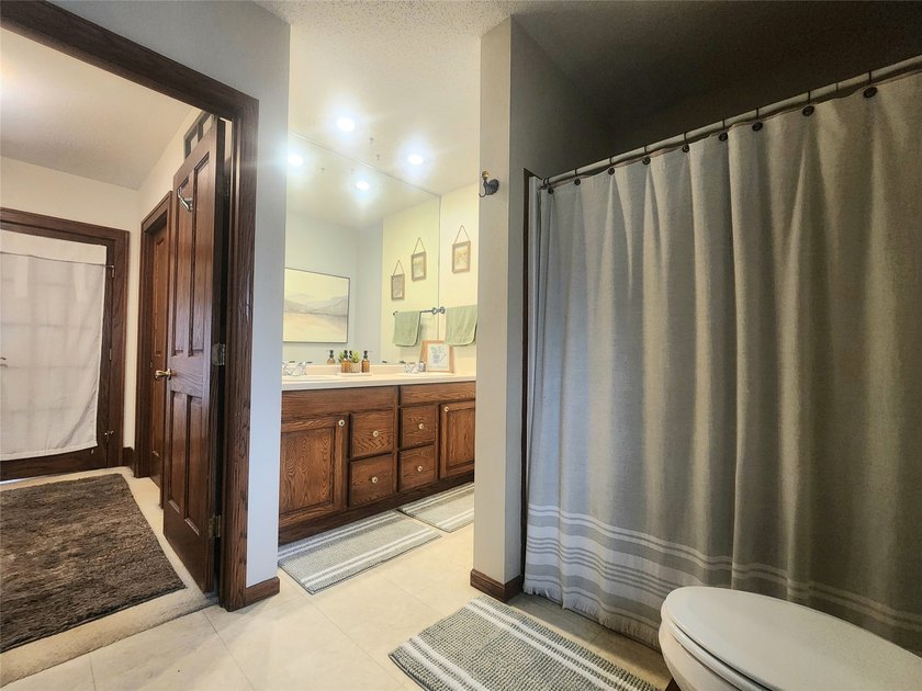 Nestled in a quiet, tree-lined neighborhood, this three-bedroom - photo 22