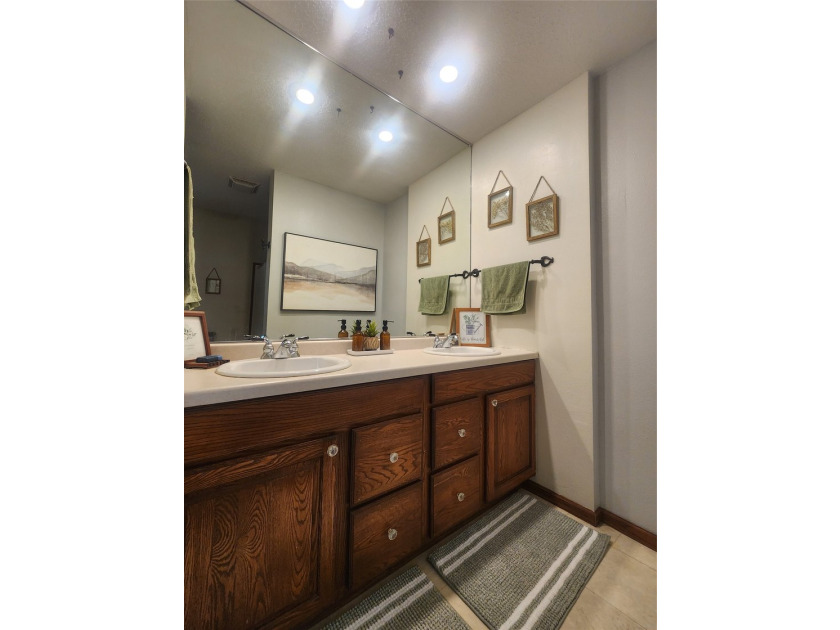 Nestled in a quiet, tree-lined neighborhood, this three-bedroom - photo 23