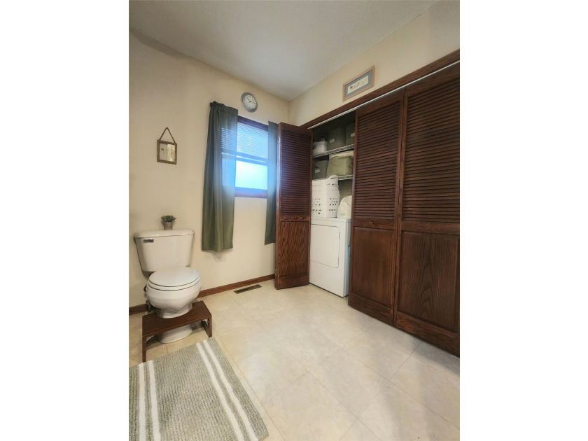 Nestled in a quiet, tree-lined neighborhood, this three-bedroom - photo 24