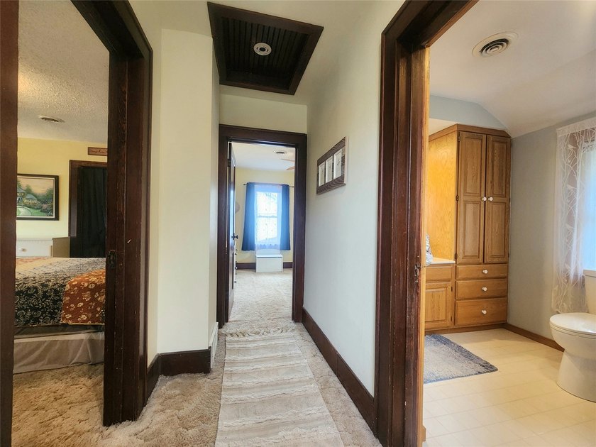 Nestled in a quiet, tree-lined neighborhood, this three-bedroom - photo 25