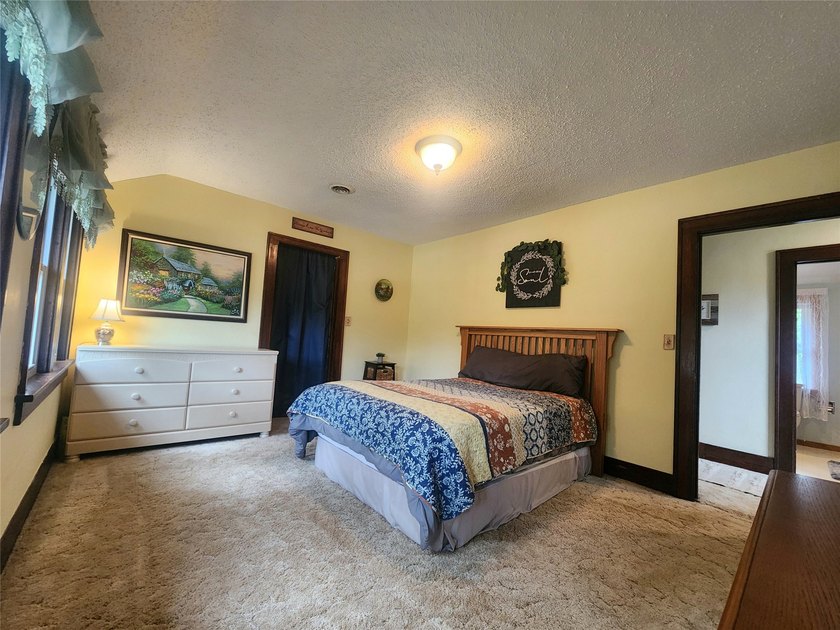 Nestled in a quiet, tree-lined neighborhood, this three-bedroom - photo 26