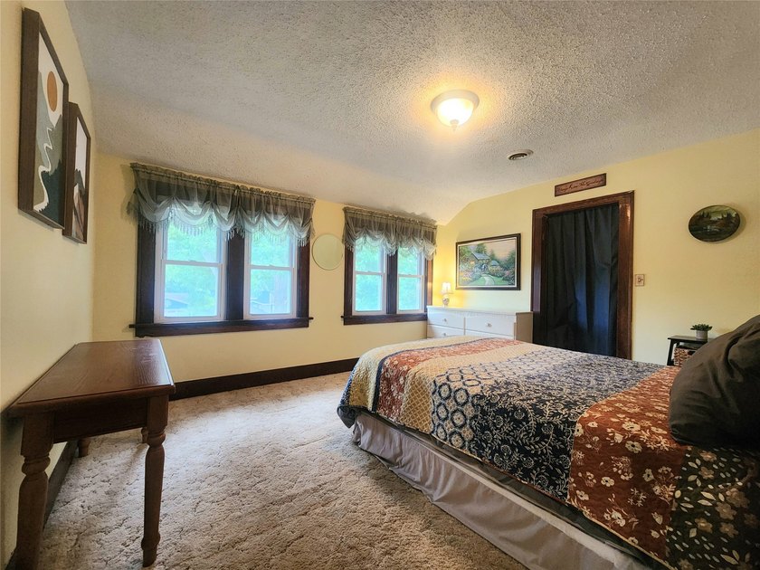 Nestled in a quiet, tree-lined neighborhood, this three-bedroom - photo 27