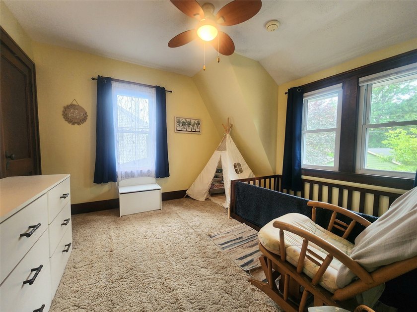 Nestled in a quiet, tree-lined neighborhood, this three-bedroom - photo 28