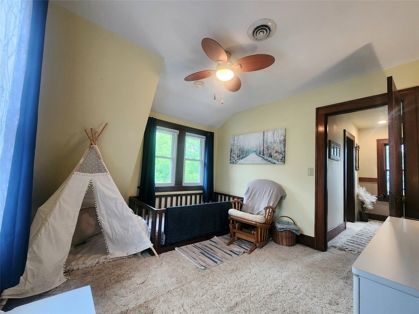 Nestled in a quiet, tree-lined neighborhood, this three-bedroom - photo 29