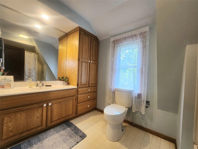 Nestled in a quiet, tree-lined neighborhood, this three-bedroom - photo 30