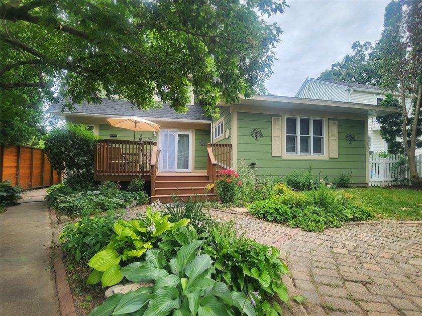 Nestled in a quiet, tree-lined neighborhood, this three-bedroom - photo 32