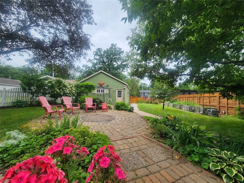 Nestled in a quiet, tree-lined neighborhood, this three-bedroom - photo 33