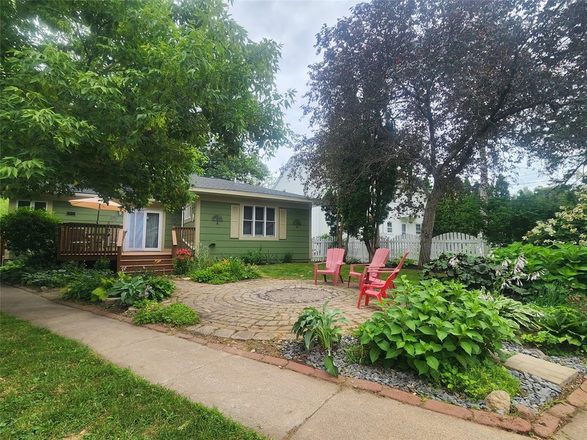 Nestled in a quiet, tree-lined neighborhood, this three-bedroom - photo 35