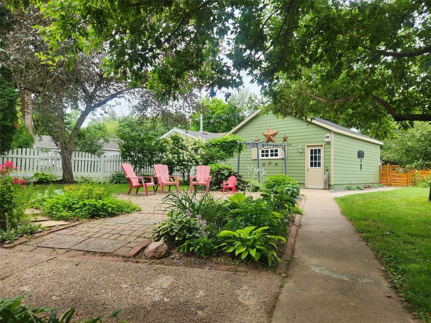 Nestled in a quiet, tree-lined neighborhood, this three-bedroom - photo 37