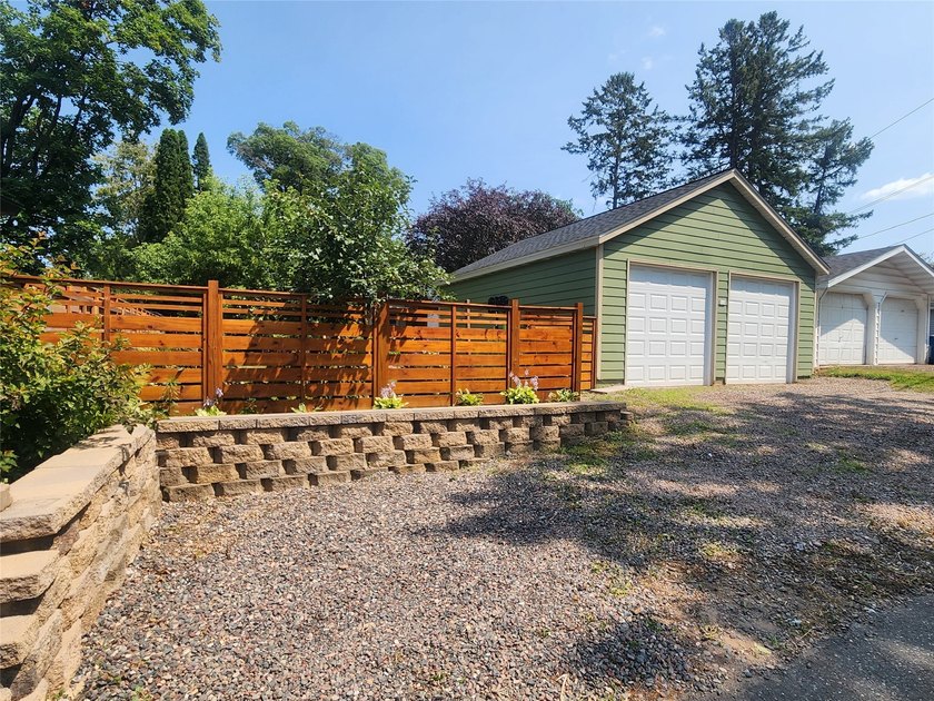 Nestled in a quiet, tree-lined neighborhood, this three-bedroom - photo 39