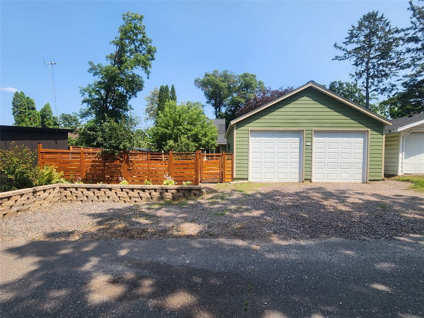 Nestled in a quiet, tree-lined neighborhood, this three-bedroom - photo 40