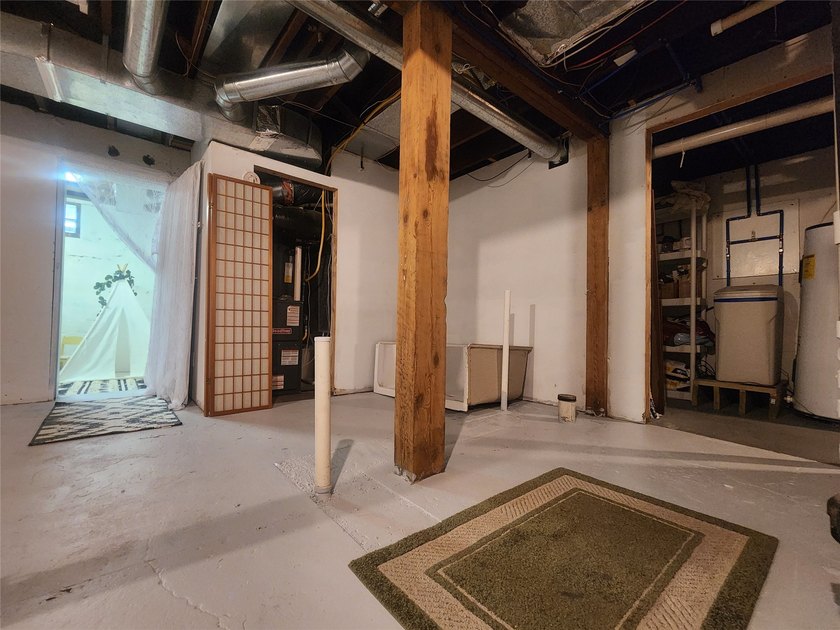 Nestled in a quiet, tree-lined neighborhood, this three-bedroom - photo 42