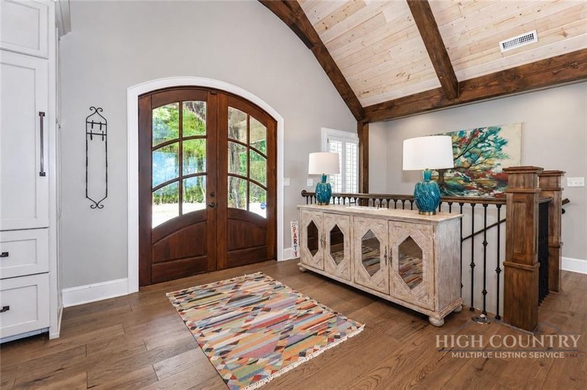 Experience elegant mountain living in this warm and inviting - photo 11