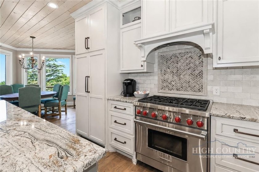 Experience elegant mountain living in this warm and inviting - photo 18