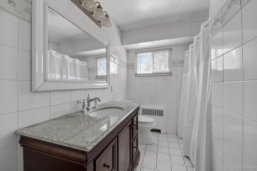 Nestled on a quiet, tree-lined street in a highly desirable - photo 14