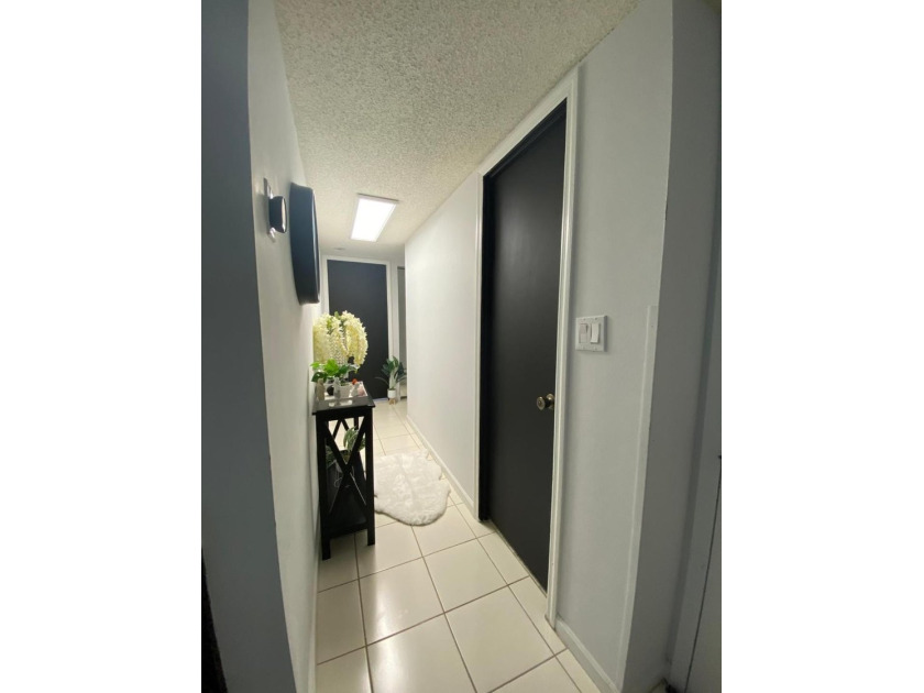 This spacious 2-bedroom, 2-bathroom unit features an open living - photo 2