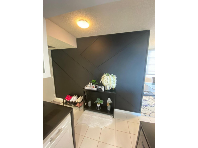 This spacious 2-bedroom, 2-bathroom unit features an open living - photo 3