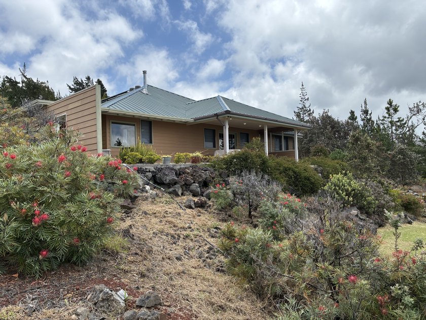 Perched atop a private hilltop with Pacific Ocean views, this - photo 8