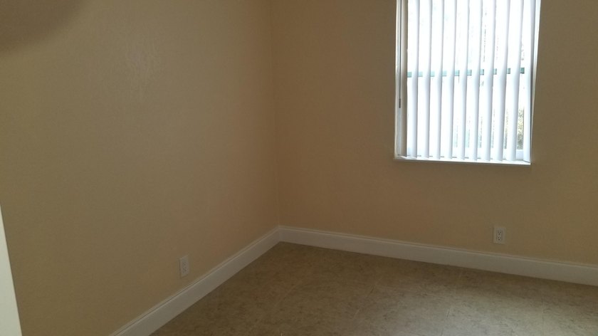 This updated ground floor unit features closed in porch; - photo 8