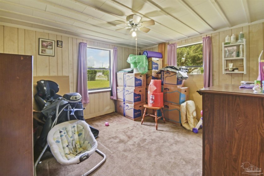 This spacious POOL home is positioned on NEARLY AN ACRE in the - photo 15