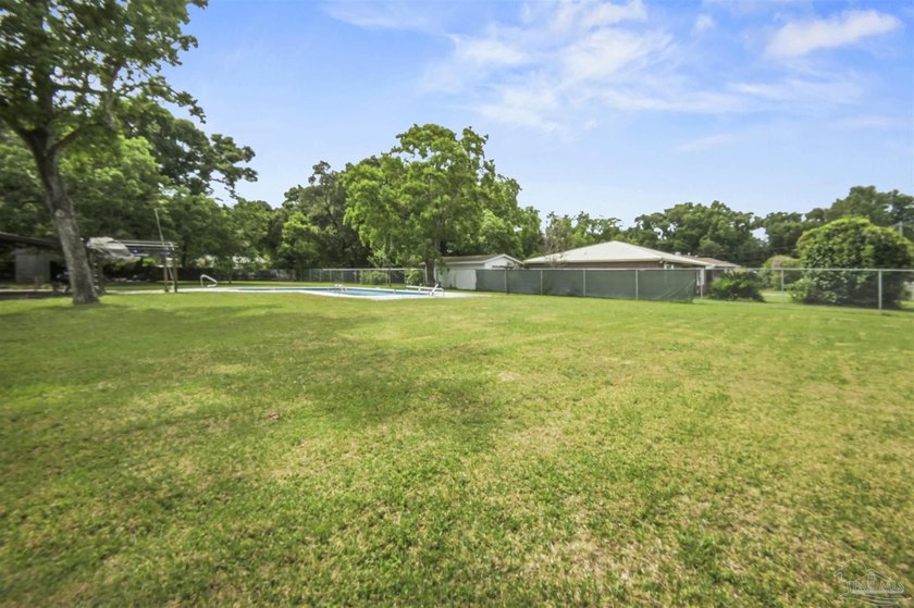 This spacious POOL home is positioned on NEARLY AN ACRE in the - photo 21