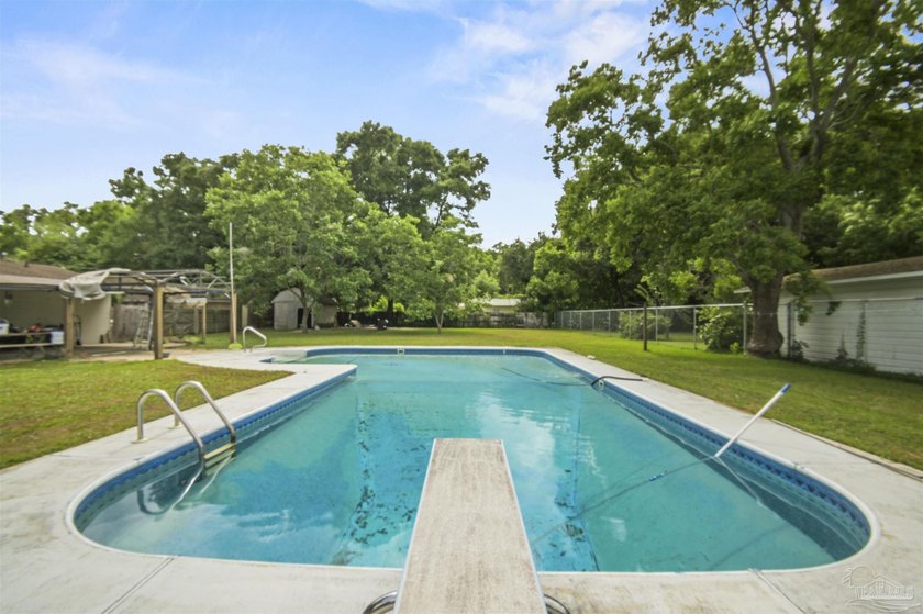This spacious POOL home is positioned on NEARLY AN ACRE in the - photo 24
