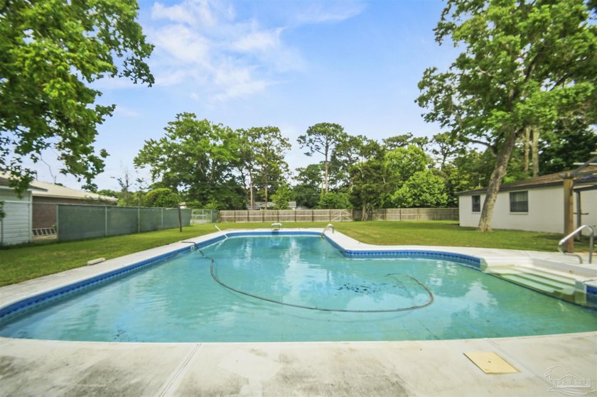 This spacious POOL home is positioned on NEARLY AN ACRE in the - photo 27