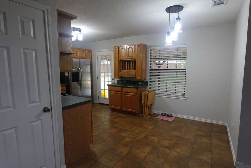 Updated brick home with an open-concept floor plan and a - photo 7