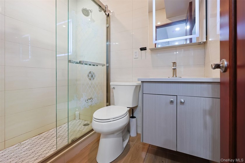 Welcome to this luxury detached two-family residence located in - photo 40