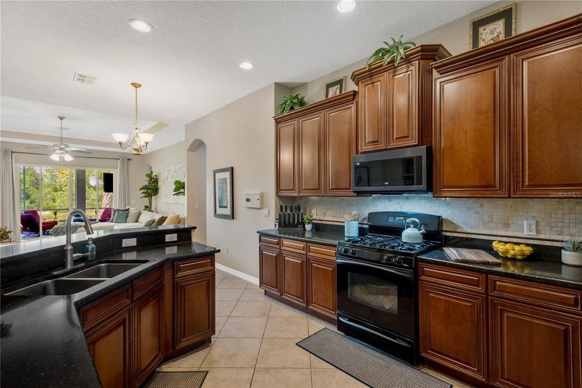 Welcome to this exceptional residence nestled within the highly - photo 3