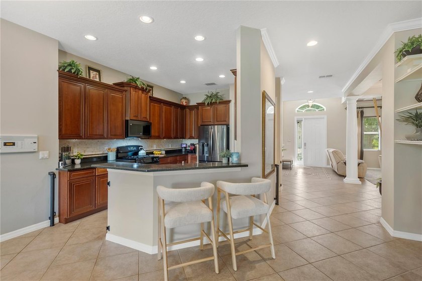 Welcome to this exceptional residence nestled within the highly - photo 5