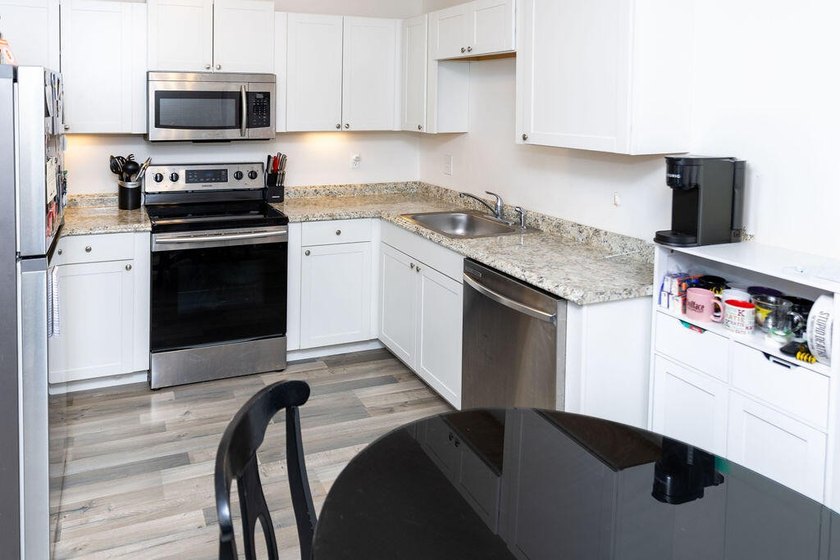 This charming home features updated kitchen and bathrooms with - photo 5