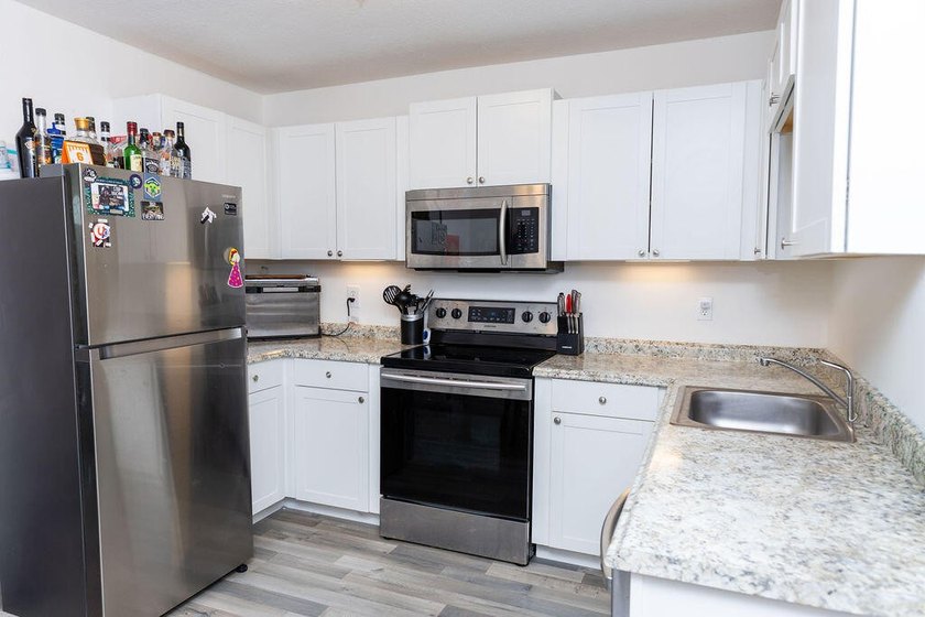 This charming home features updated kitchen and bathrooms with - photo 6