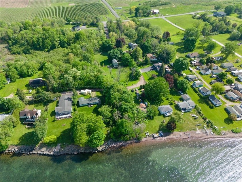 Welcome to this charming lakeside retreat tucked away on a - photo 42