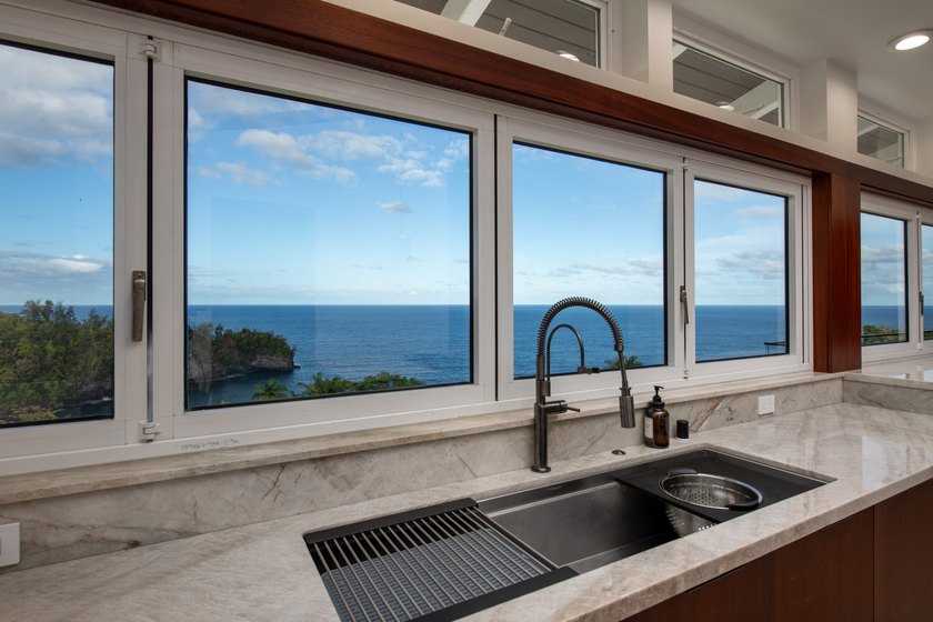 A newly reimagined oceanfront masterpiece perched above the - photo 9