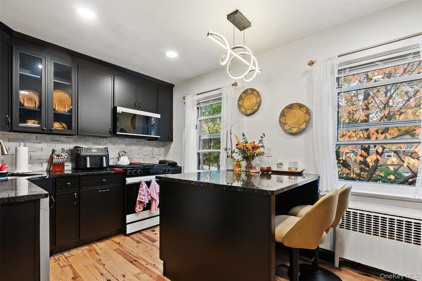This bright and spacious commuter's dream offers everything you - photo 3