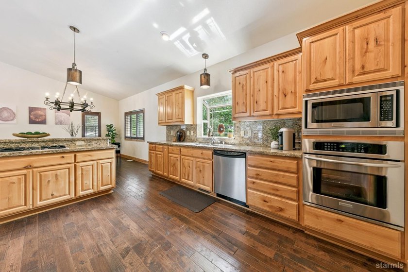 Located in the desirable Tahoe Island Park neighborhood, this - photo 21