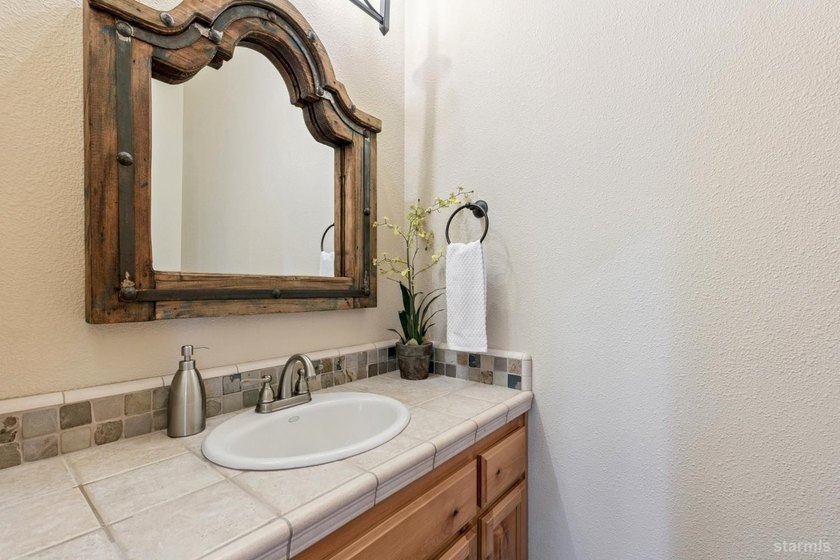 Located in the desirable Tahoe Island Park neighborhood, this - photo 23