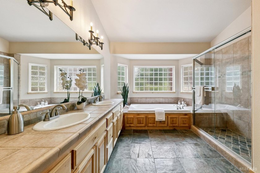 Located in the desirable Tahoe Island Park neighborhood, this - photo 28