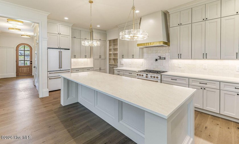 This grand home offers an impressive layout filled with style - photo 19