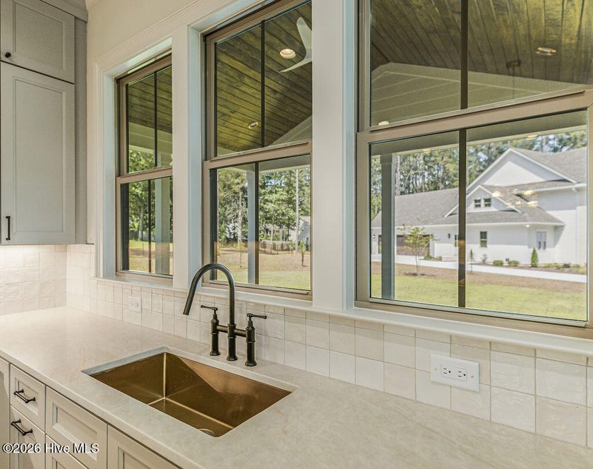 This grand home offers an impressive layout filled with style - photo 21