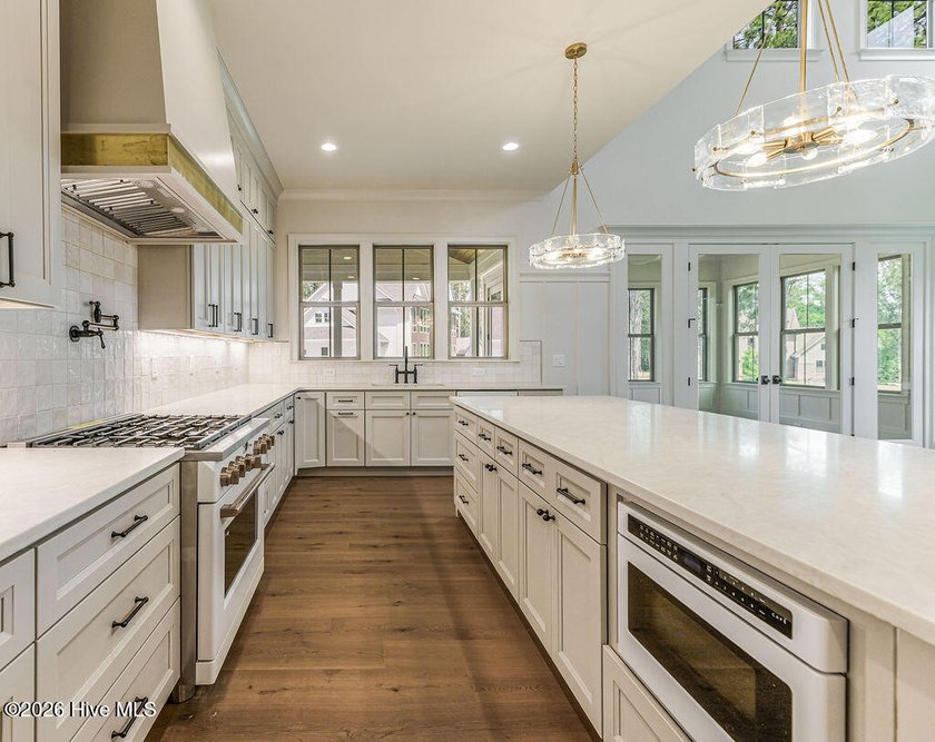 This grand home offers an impressive layout filled with style - photo 24