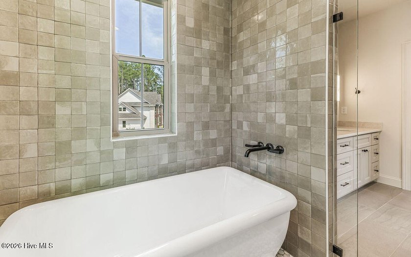 This grand home offers an impressive layout filled with style - photo 46