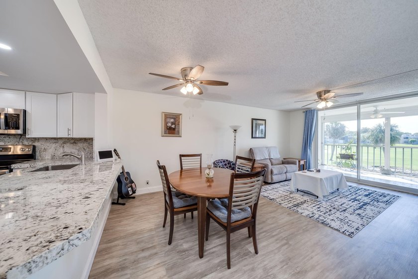 Nestled in a vibrant 55+ community, this completely remodeled in - photo 11