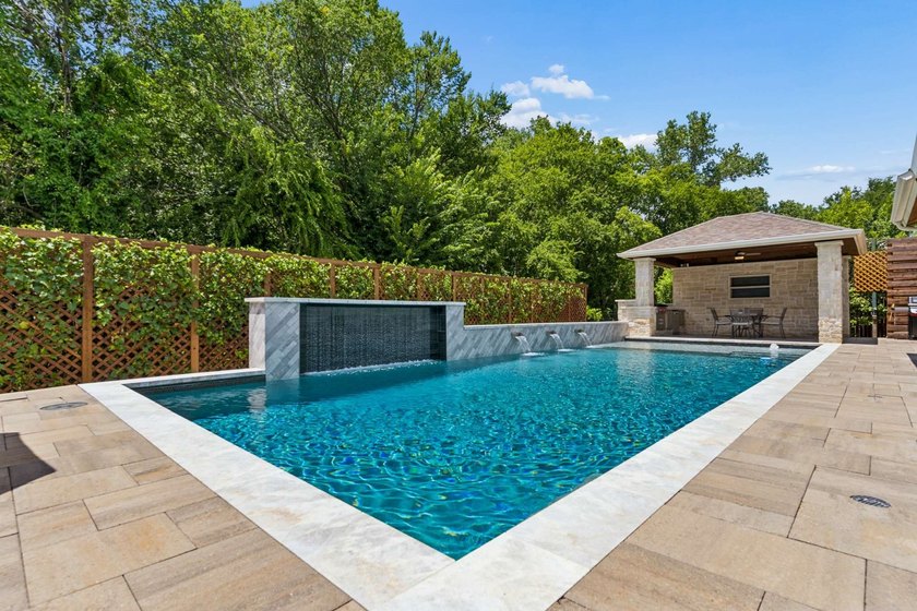 Over $600,000 in renovations have transformed this exceptional - photo 2