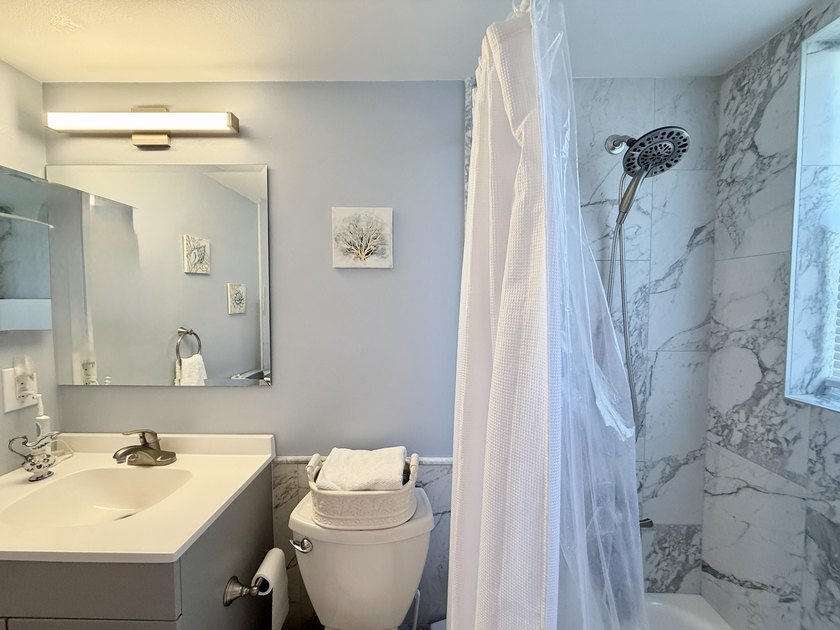Beautifully updated furnished 1 bedroom, 1.5 bath condo located - photo 12