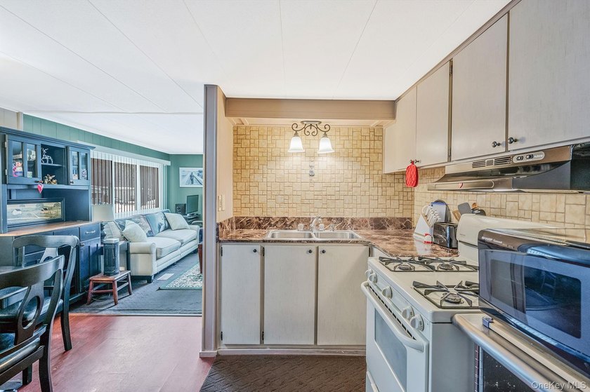 Charming 2-Bedroom Mobile Home in River Woods Welcome to this - photo 12