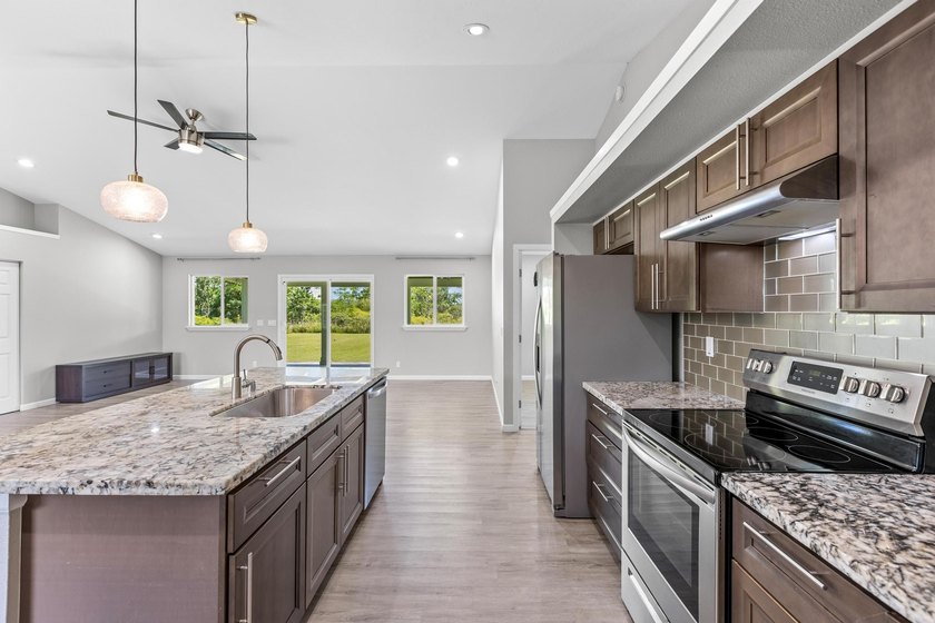 Welcome home to this charming 3-bedroom, 2-bath residence on a - photo 3