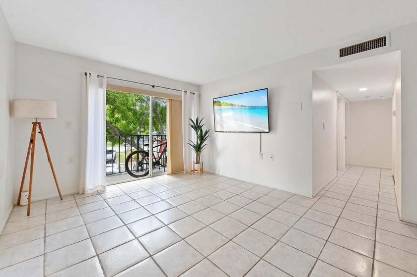 Welcome to this inviting second-floor condo in West Palm Beach - photo 2