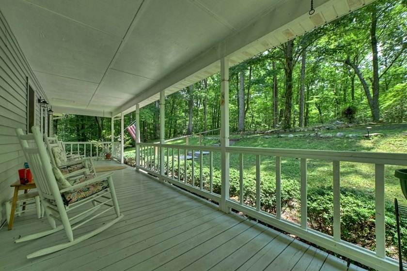 Charming cottage home nestled on nearly 7 private wooded acres - photo 5